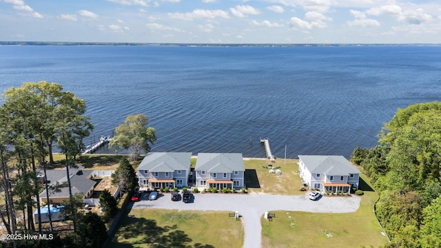 drone / aerial view with a residential view and a water view