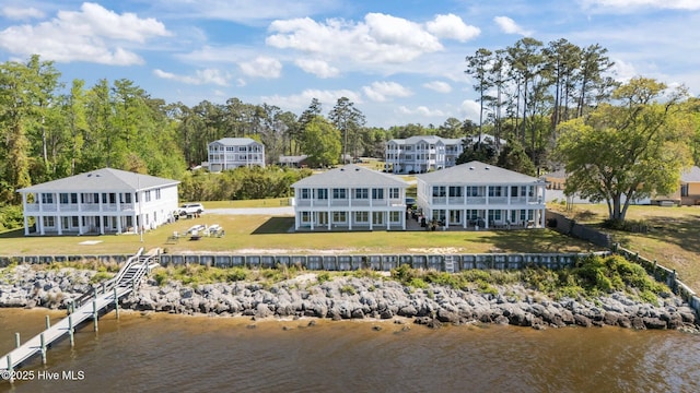 birds eye view of property with a water view