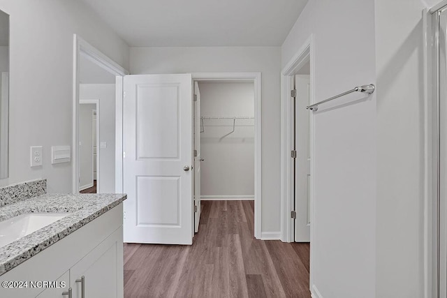 238 Kite Cir NE Lot 666, Bolivia, NC 28422 - bathroom featuring baseboards, wood finished floors, and vanity