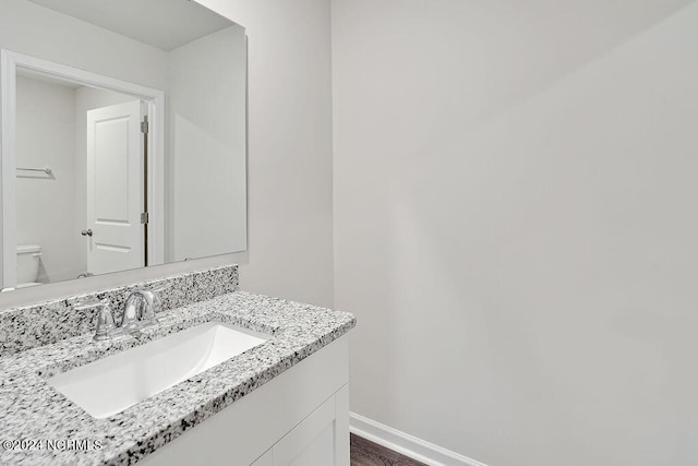 238 Kite Cir NE Lot 666, Bolivia, NC 28422 - half bathroom with toilet, vanity, and baseboards