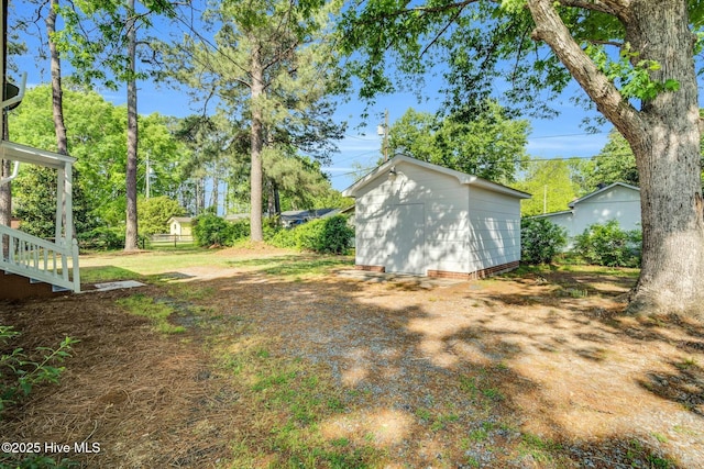 310 Chicopee Rd, Benson, NC 27504 - view of yard with a storage unit