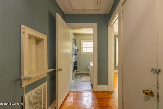503 Spring St, Hamlet, NC 28345 - hallway featuring light wood-style flooring and baseboards