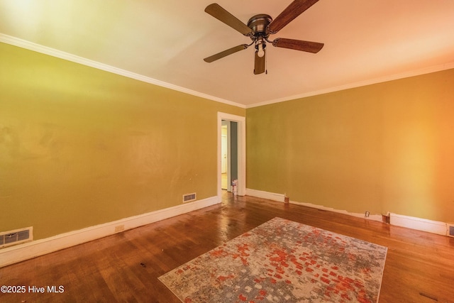 503 Spring St, Hamlet, NC 28345 - spare room with a ceiling fan, wood finished floors, crown molding, and baseboards