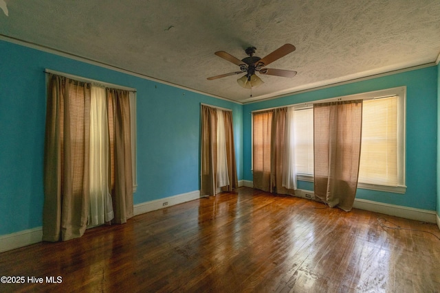 503 Spring St, Hamlet, NC 28345 - spare room featuring a textured ceiling, wood finished floors, a ceiling fan, baseboards, and crown molding