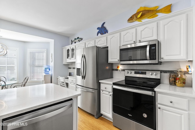 kitchen featuring light countertops, white cabinetry, and appliances with stainless steel finishes