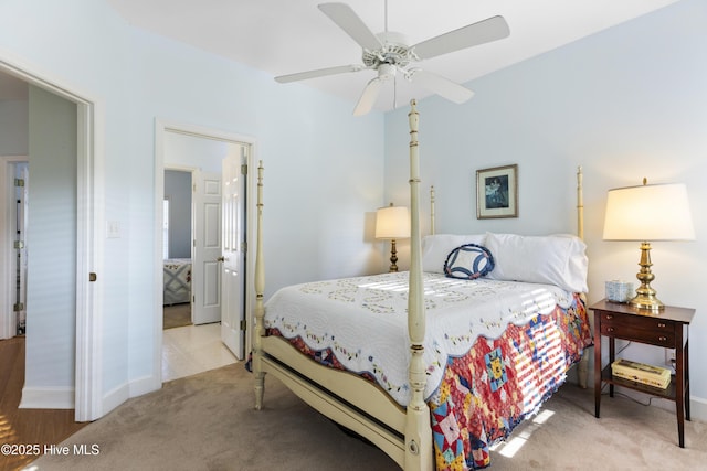 carpeted bedroom featuring baseboards and ceiling fan