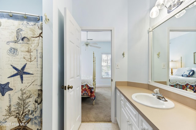 ensuite bathroom featuring vanity, a ceiling fan, and ensuite bath