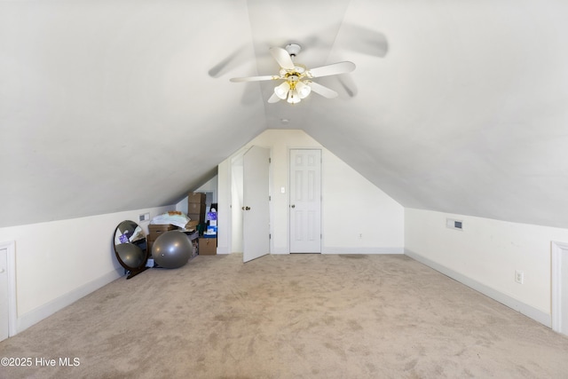 bonus room featuring baseboards, ceiling fan, carpet, and lofted ceiling