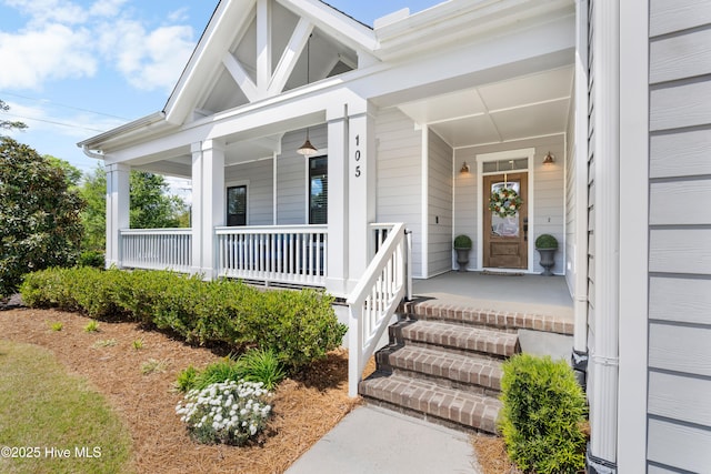 property entrance with covered porch