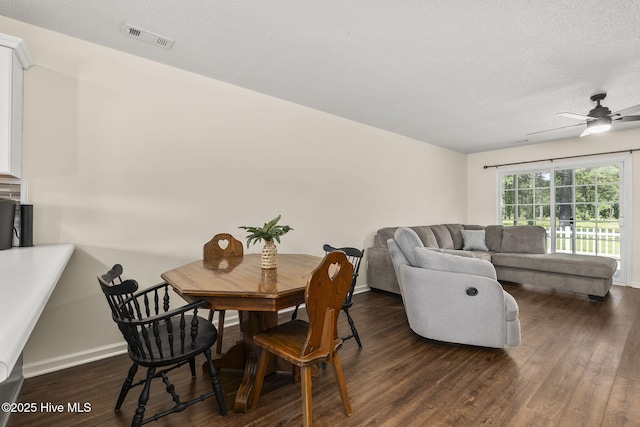601 Pelletier Loop Rd Unit M76Silver, Creek Townhomes, Peletier, NC 28584 - dining area featuring dark wood-style floors, a textured ceiling, baseboards, and ceiling fan