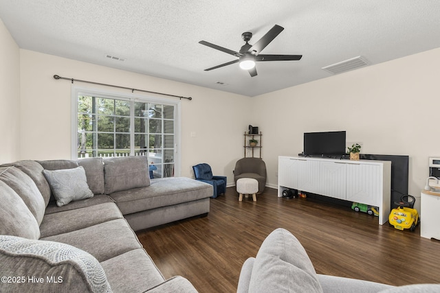 601 Pelletier Loop Rd Unit M76Silver, Creek Townhomes, Peletier, NC 28584 - living area featuring wood finished floors, a ceiling fan, and a textured ceiling
