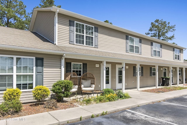 601 Pelletier Loop Rd Unit M76Silver, Creek Townhomes, Peletier, NC 28584 - view of property with a porch and uncovered parking