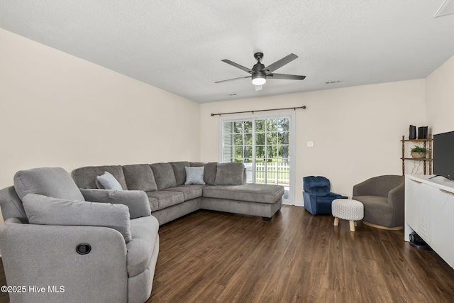 601 Pelletier Loop Rd Unit M76Silver, Creek Townhomes, Peletier, NC 28584 - living room featuring dark wood finished floors, ceiling fan, and a textured ceiling