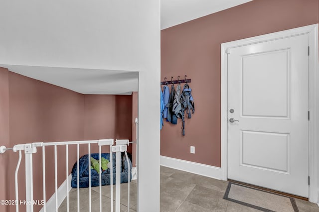 hall featuring baseboards