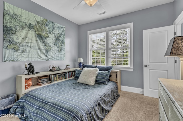 bedroom featuring visible vents, a ceiling fan, baseboards, and light carpet