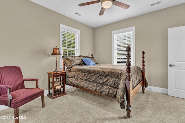 bedroom featuring baseboards, carpet flooring, and visible vents