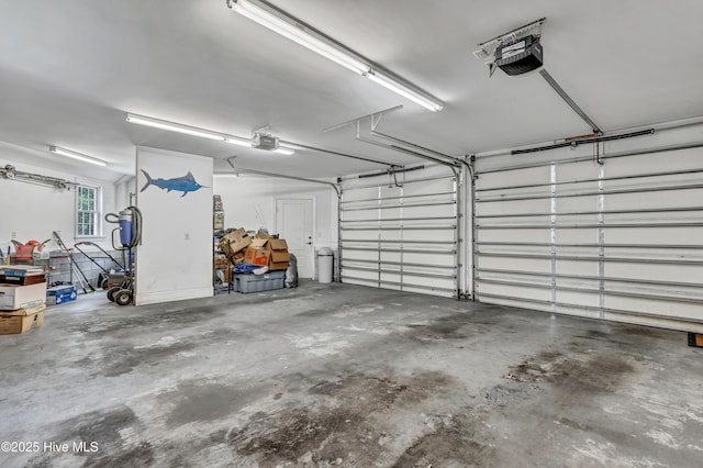 garage featuring a garage door opener