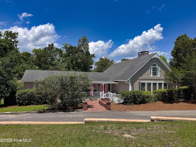 522 Hughes Rd, Hampstead, NC 28443 - view of front of home featuring a chimney and a porch
