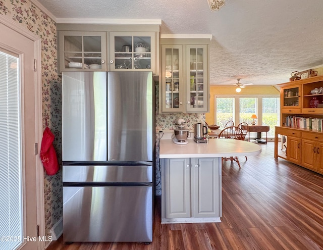 522 Hughes Rd, Hampstead, NC 28443 - kitchen featuring freestanding refrigerator, wallpapered walls, a textured ceiling, dark wood-type flooring, and gray cabinets
