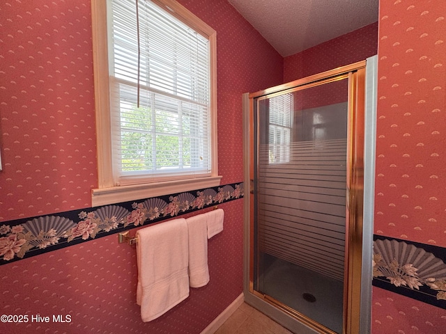 522 Hughes Rd, Hampstead, NC 28443 - full bath featuring wallpapered walls, a stall shower, and a textured ceiling