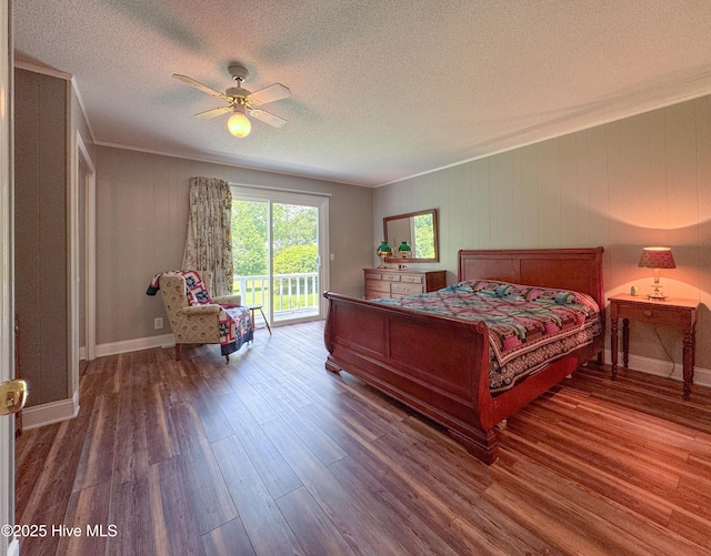 522 Hughes Rd, Hampstead, NC 28443 - bedroom with access to exterior, wood finished floors, a textured ceiling, a ceiling fan, and baseboards