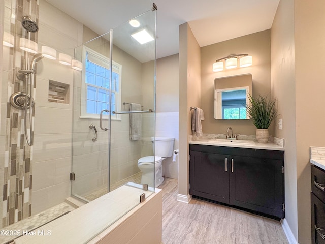 522 Hughes Rd, Hampstead, NC 28443 - bathroom featuring vanity, a stall shower, plenty of natural light, and toilet