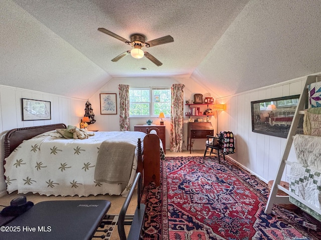 522 Hughes Rd, Hampstead, NC 28443 - bedroom with a textured ceiling, vaulted ceiling, carpet floors, and ceiling fan