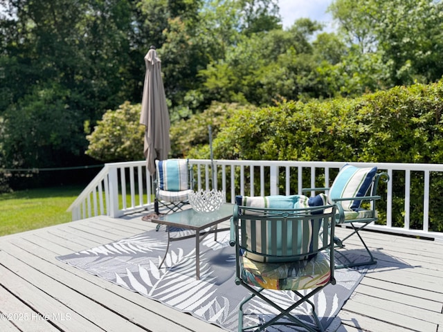 522 Hughes Rd, Hampstead, NC 28443 - wooden terrace with view of scattered trees and outdoor lounge area