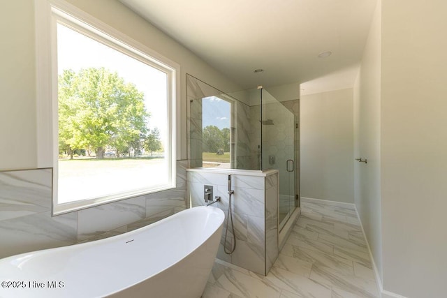 1102 Soundside Rd, Edenton, NC 27932 - bathroom with a freestanding tub, a shower stall, and marble finish flooring