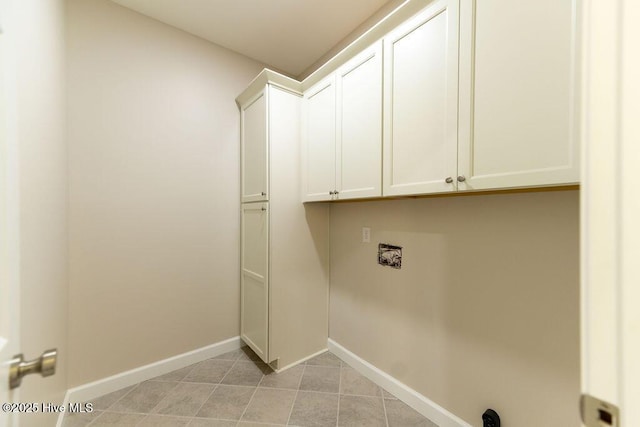 1102 Soundside Rd, Edenton, NC 27932 - washroom with cabinet space, baseboards, washer hookup, and light tile patterned floors