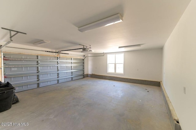 1102 Soundside Rd, Edenton, NC 27932 - garage with a garage door opener and baseboards