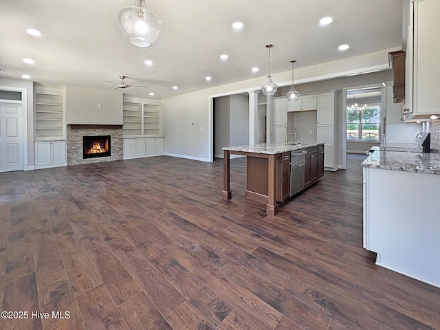 1102 Soundside Rd, Edenton, NC 27932 - kitchen with a sink, appliances with stainless steel finishes, dark wood-style flooring, a ceiling fan, and recessed lighting