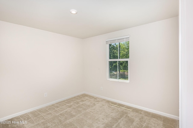 8840 Shallow Creek Trl, Bailey, NC 27807 - spare room with baseboards and light colored carpet