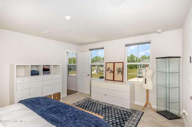 8840 Shallow Creek Trl, Bailey, NC 27807 - bedroom with baseboards, visible vents, and light carpet