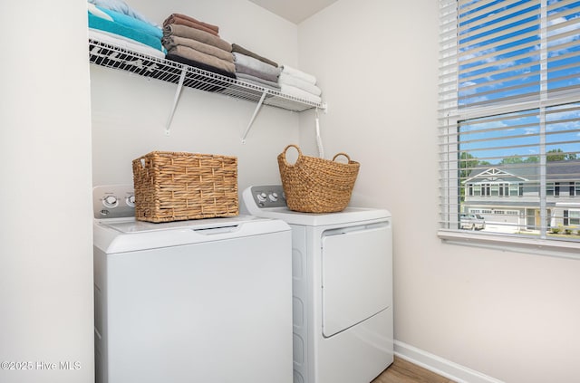 8840 Shallow Creek Trl, Bailey, NC 27807 - laundry area featuring baseboards, laundry area, washer and clothes dryer, and light wood finished floors