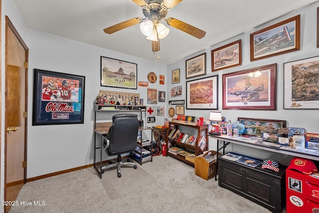 office featuring ceiling fan, carpet floors, and a textured ceiling