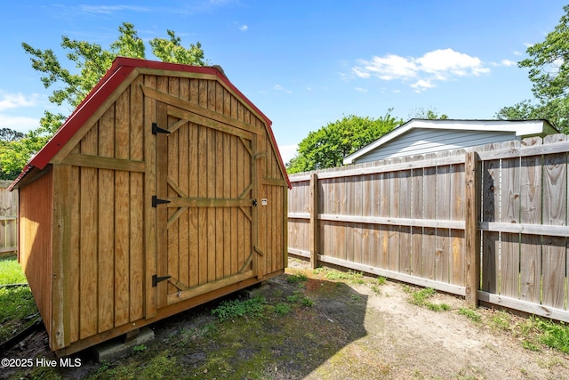 view of shed with a fenced backyard