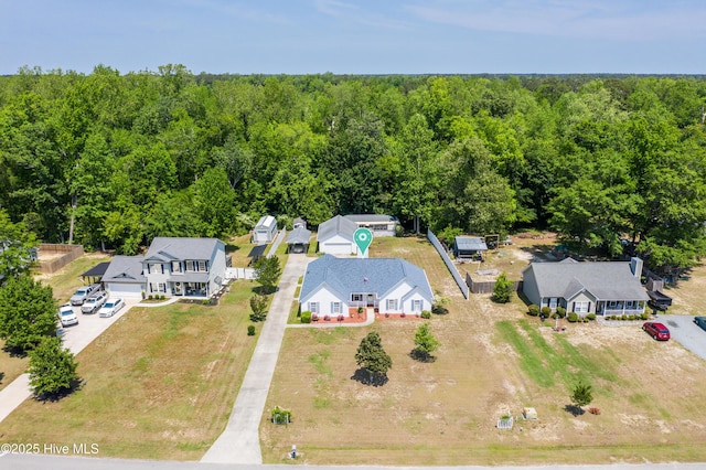 aerial view featuring a wooded view