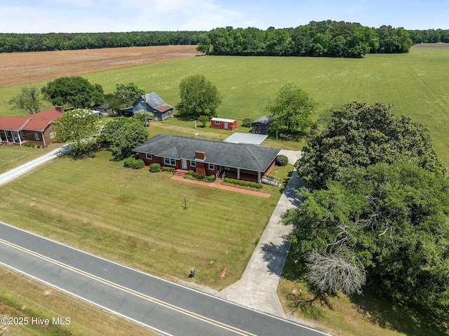 birds eye view of property with a rural view