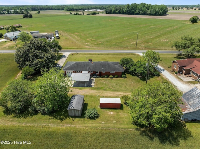birds eye view of property with a rural view