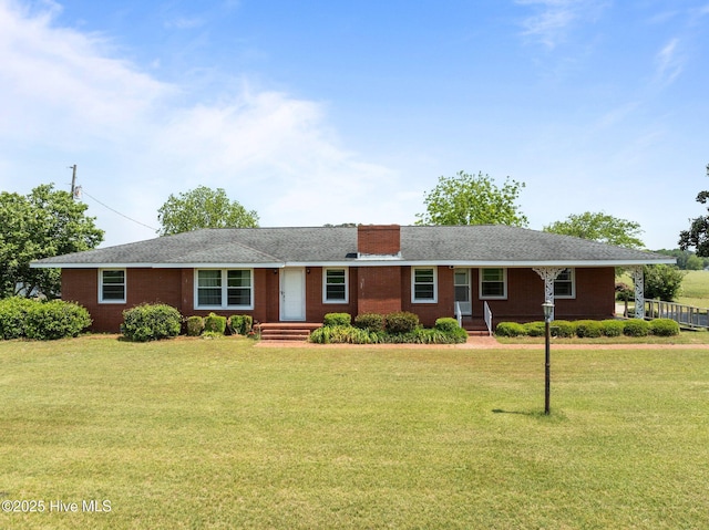 single story home featuring a chimney and a front yard