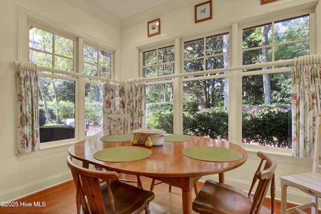 7102 Saybrook Dr, Wilmington, NC 28405 - dining space featuring baseboards, ornamental molding, and wood finished floors