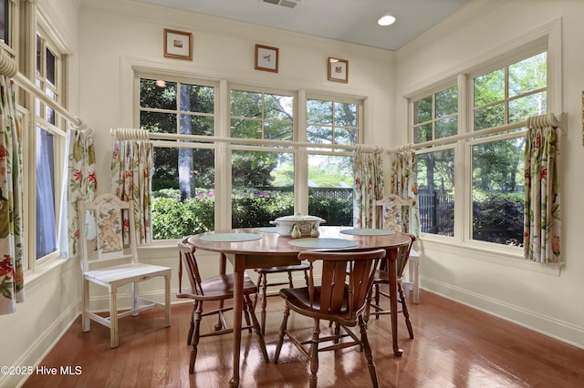 7102 Saybrook Dr, Wilmington, NC 28405 - dining area with wood-type flooring, baseboards, and ornamental molding