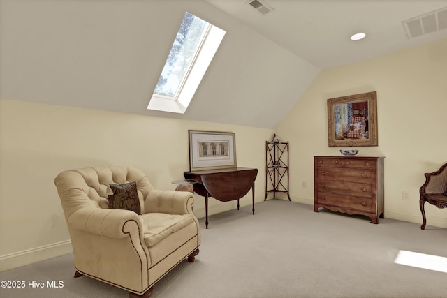 7102 Saybrook Dr, Wilmington, NC 28405 - living area with a skylight, vaulted ceiling, carpet floors, and baseboards