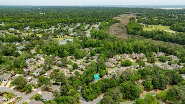 7102 Saybrook Dr, Wilmington, NC 28405 - aerial perspective of suburban area featuring a heavily wooded area