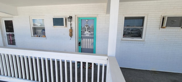 entrance to property with brick siding