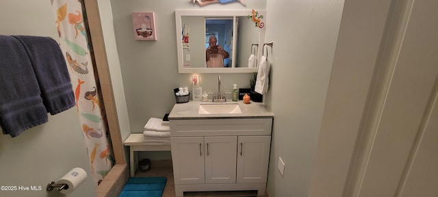 full bath with vanity and a shower with shower curtain