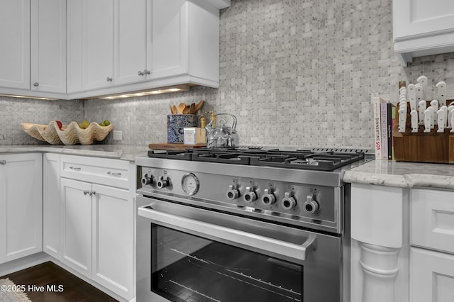 6221 Chalfont Cir, Wilmington, NC 28405 - kitchen with high end stainless steel range oven, white cabinets, and tasteful backsplash