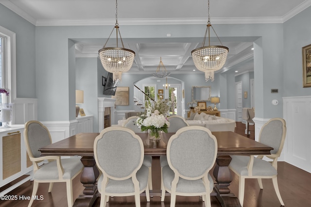 6221 Chalfont Cir, Wilmington, NC 28405 - dining area featuring crown molding, a decorative wall, stairway, coffered ceiling, and a notable chandelier