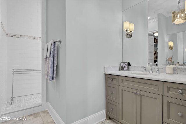6221 Chalfont Cir, Wilmington, NC 28405 - bathroom with vanity, baseboards, tiled shower, and marble finish floor